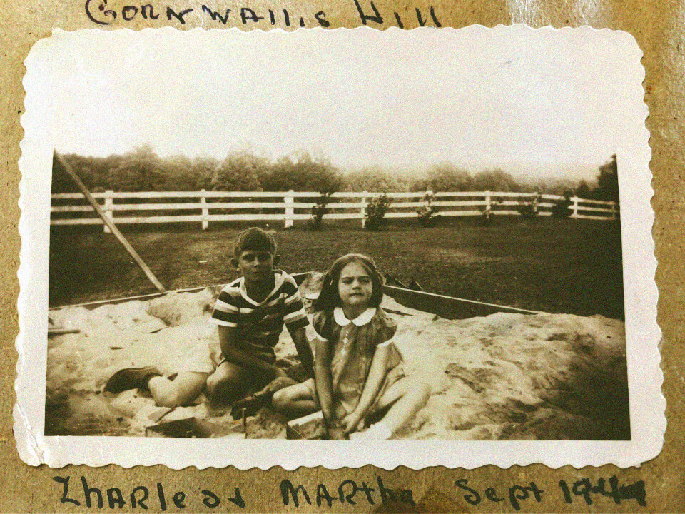 Charles Luck III and his sister playing in a sandbox