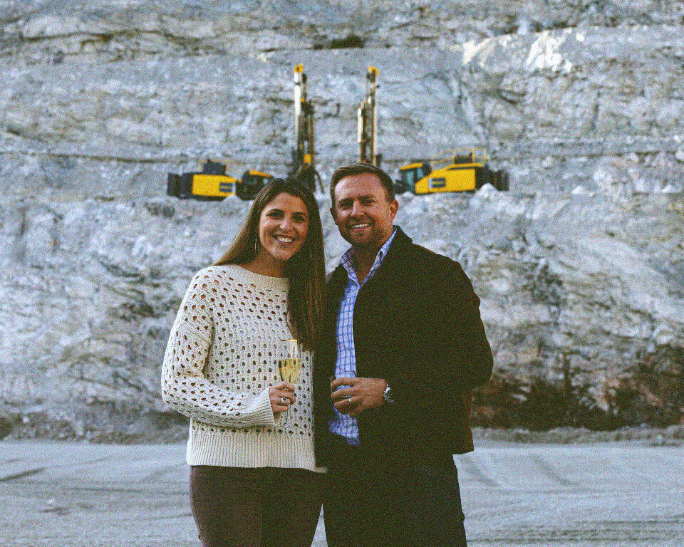 Richard Luck and wife posing with champagne in Boscobel, VA quarry